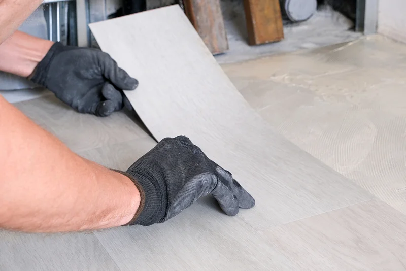 carpenter installing premium vinyl plank flooring